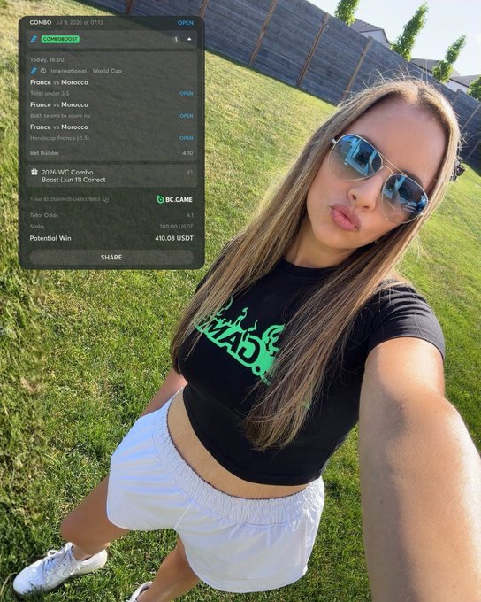 A young woman in a black t-shirt and white shorts poses outdoors, with a sports betting app overlay showing a COMBO bet on France vs Morocco and a potential win of 410.08 USDT.