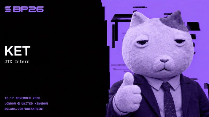 A promotional graphic for the "BP26" (Breakpoint 2026) conference features a purple-toned cat-headed figure in a suit giving a thumbs-up, with text identifying speaker "KET, JTX Intern," and event details "15-17 November 2026, London, United Kingdom." The caption "yes" appears to echo the character's approving thumbs-up gesture, suggesting enthusiastic confirmation or agreement.
