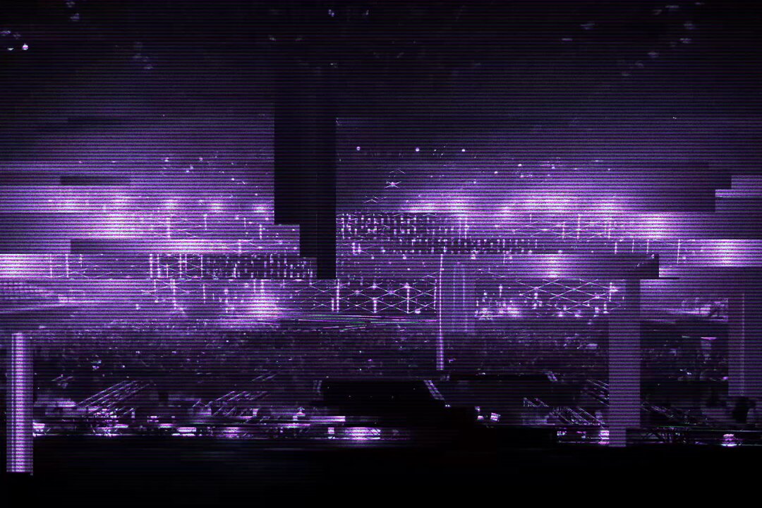 The image features a purple cityscape with buildings of various sizes and shapes, including a large building that appears to be a stadium or arena. The sky above the scene is dark and filled with stars, creating an atmosphere of mystery and intrigue. In the bottom right corner of the image, there's text that reads "Win a FREE ticket to Breakpoint 2026 in London React to this post with a *video* about your favorite Breakpoint memory". This suggests that viewers should share their favorite memories related to Breakpoint or any other topic by attaching a video to the comment section.
