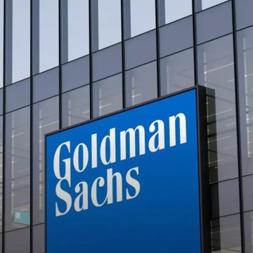 A Goldman Sachs signage sign is displayed on a building. The image relates to the post by showing the Goldman Sachs brand, referencing CEO David Solomon’s support for the Clarity Act.
