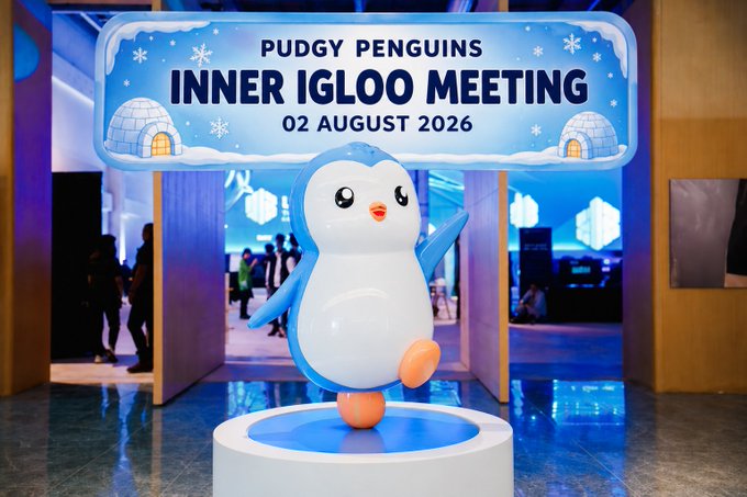 A blue and white Pudgy Penguin mascot waves cheerfully beside a sign reading "PUDGY PENGUINS INNER IGLOO MEETING 02 AUGUST 2026," promoting a recap thread about the NFT project's recent community gathering.