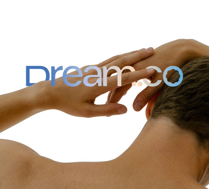 A promotional image showing a man receiving a head massage with the text 'Dream.co' overlaid in blue gradient lettering.