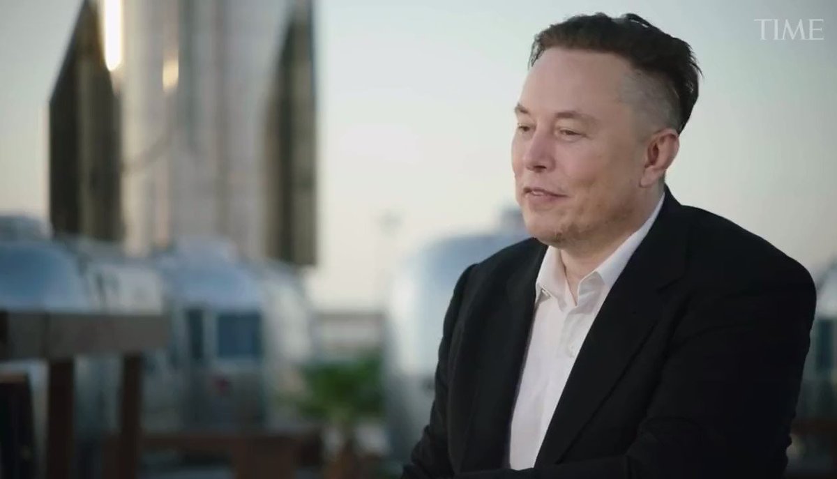 𝕏 is a company that offers tipping, payments, and microtransactions for its users. The man in the image is wearing a suit and talking about his experiences working at 𝕏.