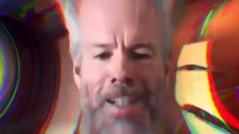 A distorted, glitchy close-up of a man's face with chromatic aberration effects, appearing to be a meme-style image.