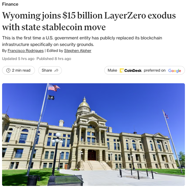 A CoinDesk news article titled 'Wyoming joins $15 billion LayerZero exodus with state stablecoin move', featuring a photo of the Wyoming State Capitol building with American and Wyoming flags.