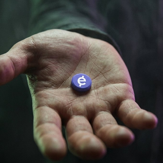 A hand holds a small purple token featuring a white cent symbol (¢) in its palm, visually representing the bounty-focused sentiment of the post "bounty pilled."