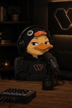 The image features a cartoon duck wearing headphones sitting at a desk with a microphone, appearing to be hosting or participating in an interview. The cartoon duck has a black hoodie with orange lettering that says "W", which could potentially indicate its role as a podcast host or interviewer. The background of the image is dark and out-of-focus, drawing attention to the cartoon duck and its surroundings.

The post discussing smaller accounts gaining more visibility in key discussions emphasizes how these accounts know how attention works by creating content that stands out from the noise. This can be compared to the cartoon duck's role as a podcast host or interviewer, who is using their unique appearance and voice to capture the audience's attention amidst other competing voices on the internet. The post also mentions crypto campaigns like those for @wallchain, which are making X scores matter more by creating signals of real, consistent engagement with their content.