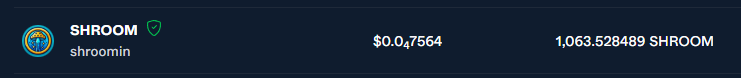 A dark-themed token information panel showing the SHROOM token with its logo, the name 'shroomin,' a price of $0.047564, and a market cap of 1,063.528489 SHROOM.