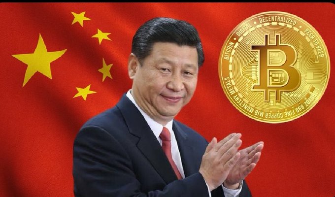The image features a man dressed in a suit standing next to a large gold coin that has the word "bitcoin" written on it. The man appears to be clapping his hands together while looking at the coin, which suggests he might have some connection or interest in Bitcoin. The presence of the gold coin and the man's attire indicate that this could be an advertisement or promotional material for Bitcoin, possibly related to China's stance on cryptocurrency.