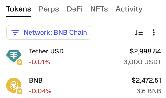 A crypto wallet interface on the BNB Chain network displays holdings of 3,000 USDT (Tether USD, valued at $2,998.84, down 0.01%) and 3.6 BNB (valued at $2,472.51, down 0.04%), showing the type of wallet address users are asked to share for the BNB giveaway.