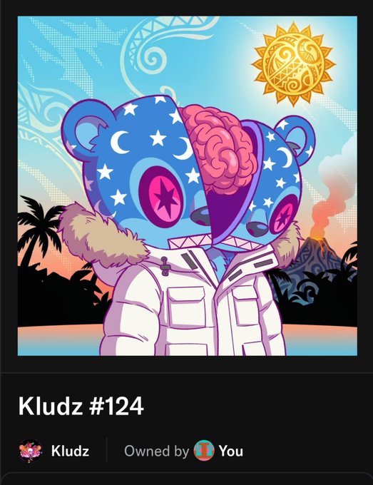 An NFT artwork titled 'Kludz #124' features a blue bear-like character with a visible brain, stars, and moon designs on its head, wearing a white winter coat against a tropical backdrop with a volcano. The interface indicates it is 'Owned by You.'