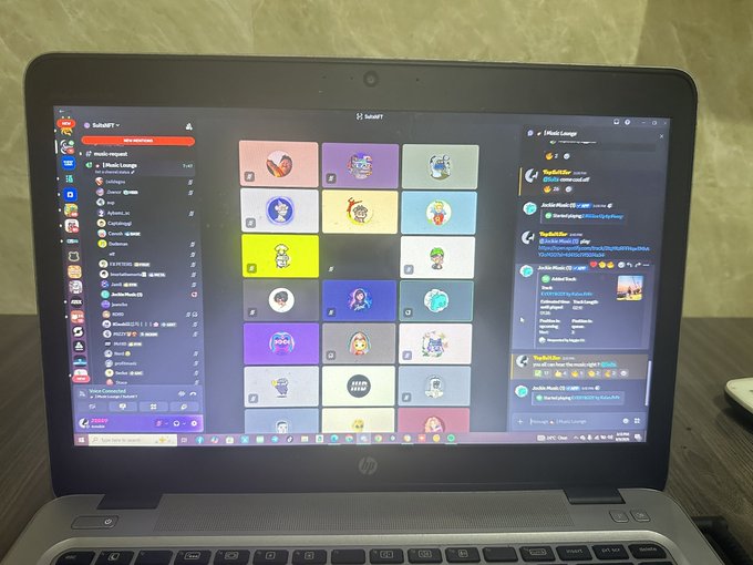 An HP laptop screen displaying the Discord application, showing a server called '1music League' with various colorful profile icons and a channel list on the left.