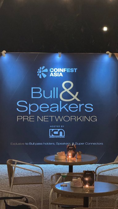 A pre-networking lounge for "Coinfest Asia: Bull & Speakers" event, hosted by ION, set up with elegant tables and chairs for exclusive attendees to connect before the cryptocurrency conference.