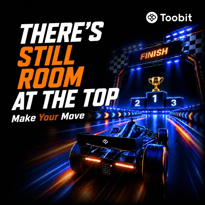 An advertisement for Toobit cryptocurrency exchange featuring a formula race car heading toward a podium with the text 'THERE'S STILL ROOM AT THE TOP' and 'Make Your Move'.