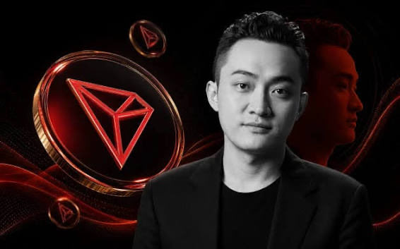 A man in a black suit appears alongside a glowing red TRON (TRX) cryptocurrency logo graphic.