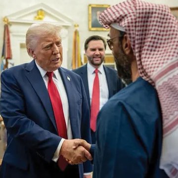This image shows Donald Trump shaking hands with a man wearing traditional Arab attire, likely representing the Abu Dhabi royal group mentioned in the accompanying text about a significant stake acquisition. The context suggests this meeting is related to the reported 49% stake in World Liberty Financial's proposed U.S. trust bank.