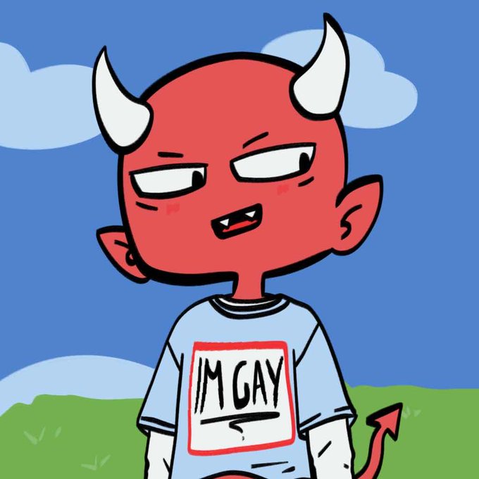 A cartoon illustration of a red devil character with white horns wearing a light blue t-shirt that has 'IM GAY' written on a white label, set against a sky with clouds and green grass.