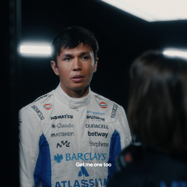 A Williams Racing driver is shown wearing a racing suit with prominent sponsor logos including "Kraken", hinting at the accompanying post about the Kraken Card. The text overlay "Get me one too" encourages viewers to also obtain the card.