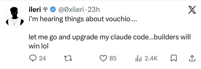 A screenshot of a tweet from verified user @0xileri reading "i'm hearing things about vouchio.... let me go and upgrade my claude code...builders will win lol," with 24 replies, 85 likes, and 2.4K views. The post "told you" suggests the tweeter was prescient about "vouchio," implying their excitement to upgrade their "claude code" was justified.