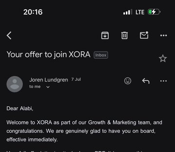 A screenshot of an email with the subject 'Your offer to join XORA' from Joren Lundgren, addressed to 'Alabi,' welcoming them to the Growth & Marketing team.