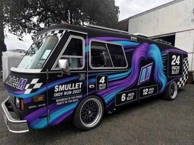 A colorful custom motorhome advertising '$MULLET INDY RUN 2027' with a 'Business in the front, Party in the back' theme and slot sizes of 4, 6, 12, and 24 inches on the side.