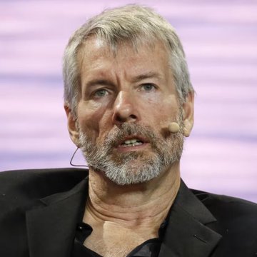 The image shows Michael Saylor, the co-founder and executive chairman of MicroStrategy (now known as Strategy), speaking at an event with a microphone visible near his face. The post highlights Strategy's substantial unrealized Bitcoin profit of over $4 billion, attributing the success to Saylor's long-term Bitcoin accumulation strategy that has significantly boosted the company's balance sheet as BTC prices have risen.
