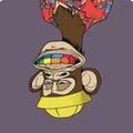 urn monkey with a yellow hat and red scarf, wearing a yellow helmet and holding a rainbow-colored object against a purple background.