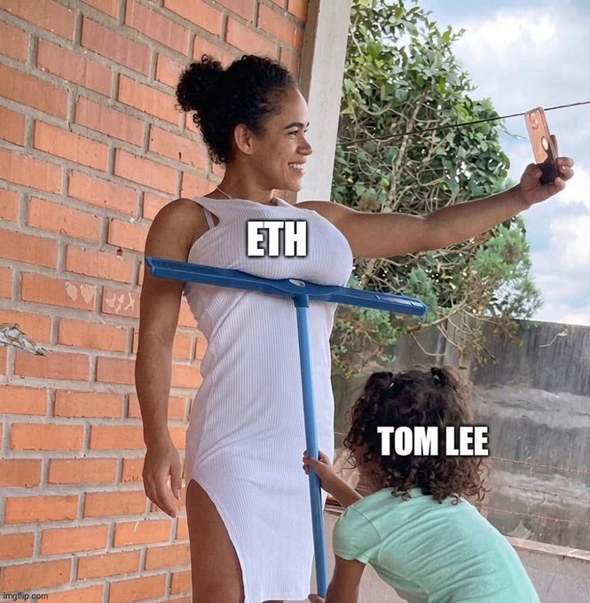A woman takes a selfie while a child pushes a broom labeled "ETH" against her body, creating a humorous visual equating the "pumping" of Ethereum to the height-boosting effect of high heels. The meme playfully illustrates the post's theme of "Tom Lee and Ethereum," using the broom (a cleaning tool, possibly referencing the name "Lee") to suggest that bullish commentary from Tom Lee is artificially propping up ETH's price like a pair of platform shoes.