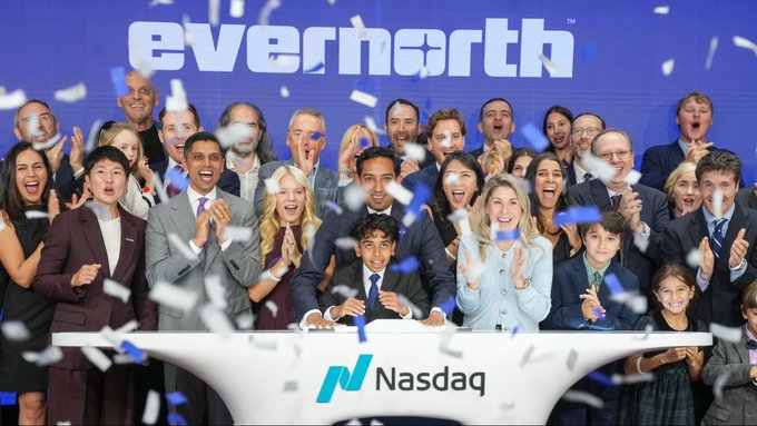 Celebratory photo of a group at the Nasdaq stock exchange with confetti falling, celebrating the 'everearth' IPO listing.