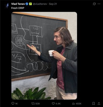 A Twitter/X post by Vlad Tanev (@vladtanev) dated Sep 21 with the caption 'Fresh DRIP', showing a man with long hair holding a coffee cup while pointing at diagrams on a chalkboard.