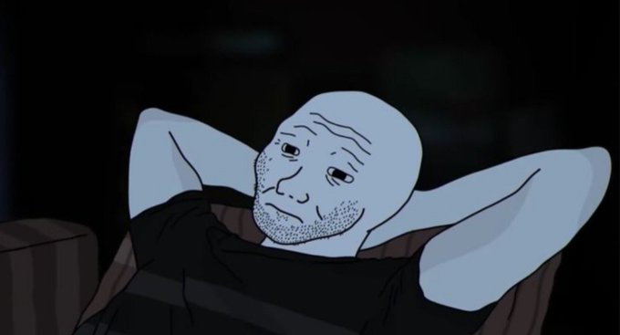An animated scene featuring a bald, blue-toned character with stubble reclining with his hands behind his head in a dark setting.