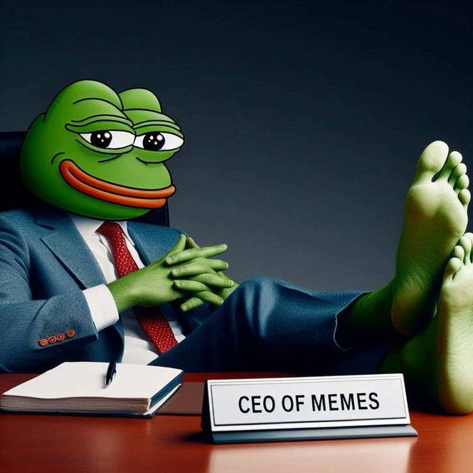 A frog-headed character wearing a blue suit and red tie sits with bare green feet propped up on a desk, next to a nameplate reading "CEO OF MEMES."