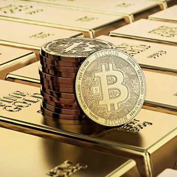 A stack of gold "999.9 FINE GOLD" bars supports a pile of Bitcoin (₿) tokens bearing the inscription "VIRES IN NUMERIS" and "FINE COPPER." The image visually represents the Kalshi prediction market's assessment that Bitcoin ($BTC) has less than a 25% chance of outperforming gold in 2026, with gold dominating the frame while Bitcoin sits atop it.