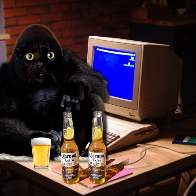 A surreal photo showing a black panther sitting at a wooden desk next to an old CRT monitor, with two Corona Extra bottles and a glass of beer in the foreground against a brick wall background.