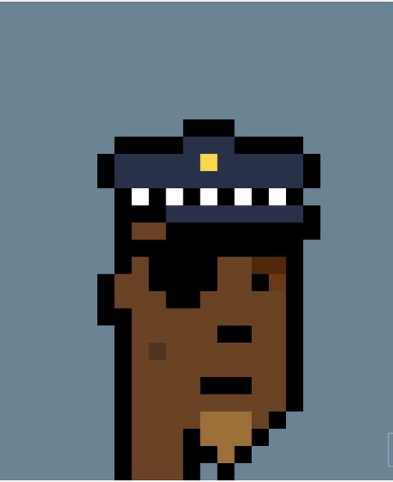 Pixel art illustration of a brown, monster-like creature with sharp teeth and a blue cap with a yellow square on it, against a gray background.