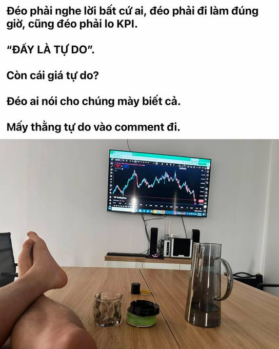 A trader smiles in her "freedom" setup, sitting barefoot with her feet up in front of a trading monitor displaying charts in a closet-turned-workspace, surrounded by hanging clothes and a pair of boots on the shelf above—capturing the irony of trading independence that comes with constant market stress.