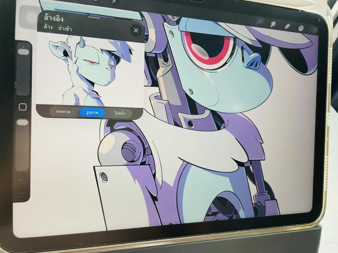 The image shows a tablet displaying a digital artwork of a robotic, goat-like character with a glowing pink eye and purple mechanical features, alongside a reference image of a goat in a drawing app. The Thai text at the top reads "ว่าง" (empty/blank), indicating an art stream in progress, which aligns with the post's mention of an art event for the "Goats of Solana" project powered by $GOATS token on the Solana blockchain.