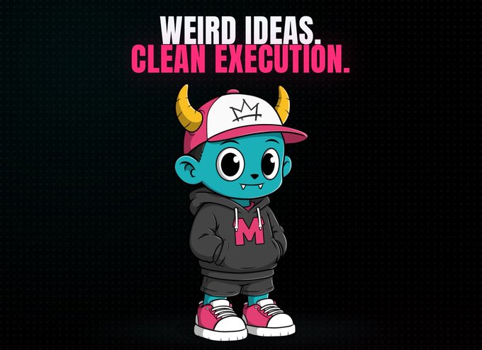 A cartoon mascot with teal skin, yellow horns, a red and white cap, and a black hoodie with a red 'M' stands below the text 'WEIRD IDEAS. CLEAN EXECUTION.'