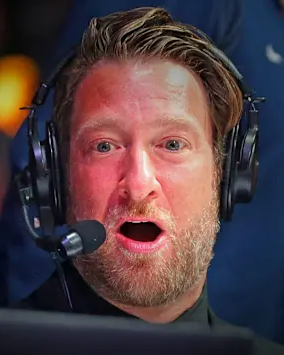 A close-up captures Dave Portnoy wearing headphones with a microphone, his mouth open mid-sentence, reacting animatedly as he discusses his crypto losses and market timing frustration.