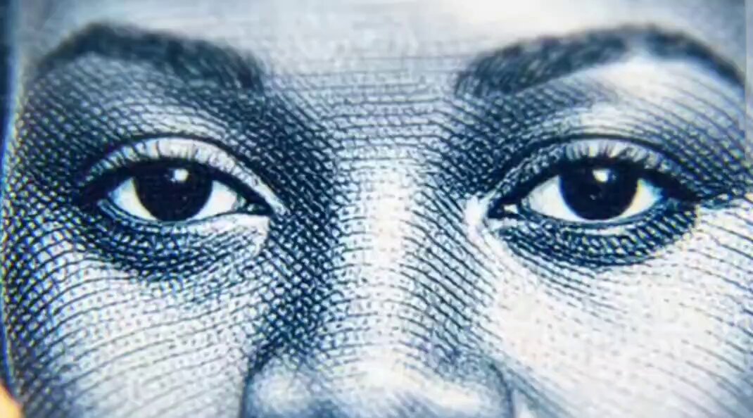 The image features a close-up of a person's face, specifically their eyes, which are the main focus of the photo. The background appears to be a grayish color or a light brown hue, providing a neutral backdrop that allows the viewer to concentrate on the subject matter. The image is accompanied by text that reads "If change is happening in finance, it' s happening everywhere, and it' s happening with @Ripple". This suggests that there might be an ongoing discussion about Ripple, a cryptocurrency or digital currency platform, which has been gaining popularity recently.