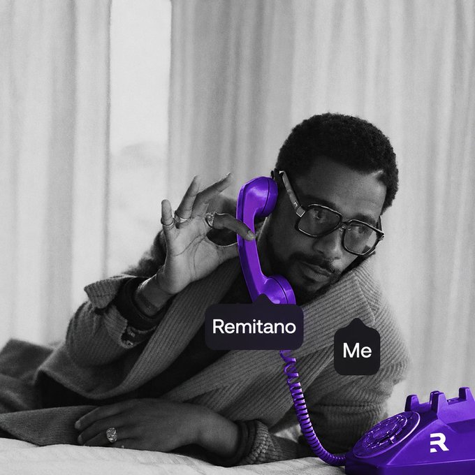 A black and white photo of a man on a phone, with the handset and base colored purple and labeled with chat bubbles reading "Remitano" and "Me".
