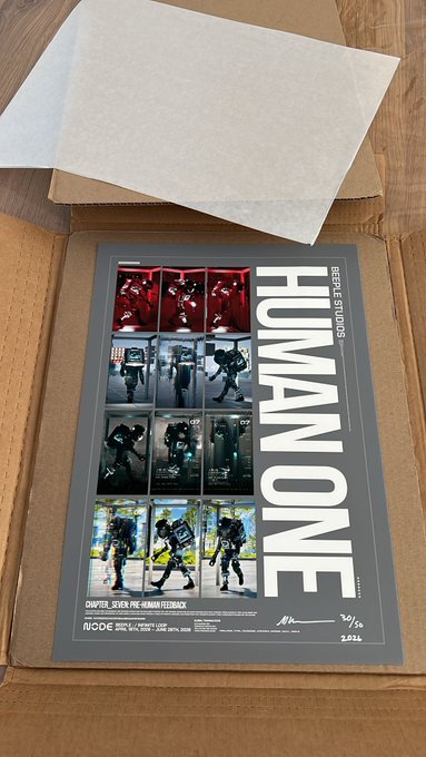 A collectible poster titled 'HUMAN ONE' from Beeple Studios, numbered 3/69 and dated 2021, shown in its shipping box.
