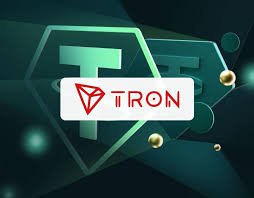 The image features a promotional graphic for the TRON blockchain, displaying its iconic diamond-shaped logo with the text "TRON" prominently in the center. Surrounding the logo are decorative golden orbs against a dark teal background, visually reinforcing the post's mention of TRON's USDD ecosystem and its capabilities for seamless stablecoin exchanges and GASFREE transfers.