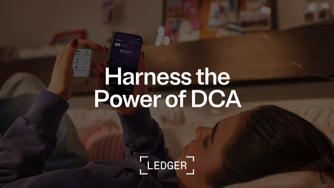 A person relaxes in bed while holding a smartphone displaying a financial chart, overlaid with the text "Harness the Power of DCA" and the Ledger logo, visually reinforcing the message that automated dollar-cost averaging through Ledger lets users invest effortlessly while focusing on their everyday lives.
