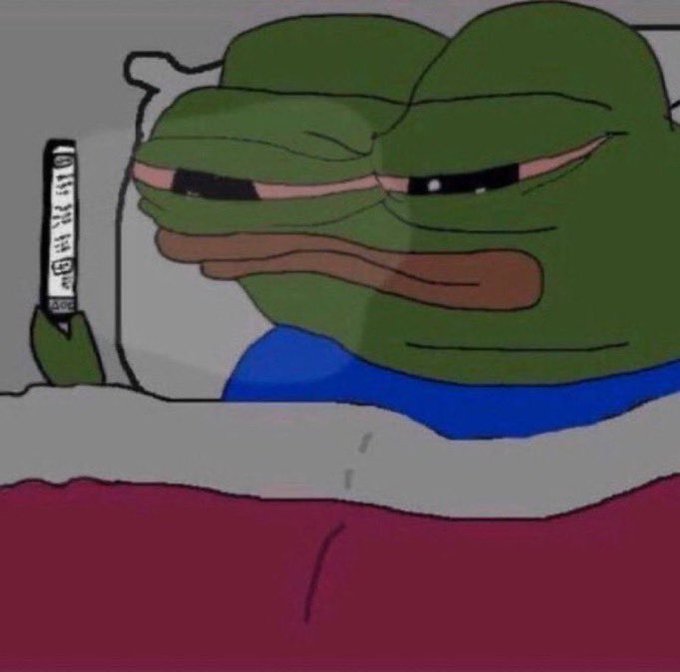A meme image of the 'sad Pepe the Frog' character lying in bed holding a smartphone in the dark, depicting loneliness or late-night phone use.