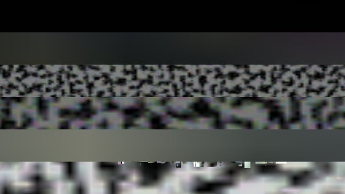 An abstract image featuring horizontal bands of dark gray, black and white pixelated textures, with a blurred photo visible at the bottom.