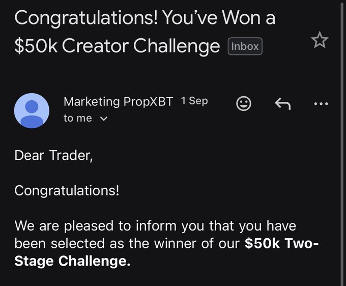 An email screenshot titled 'Congratulations! You've Won a $50k Creator Challenge' from 'Marketing PropXBT' dated '1 Sep', informing the recipient they won a '$50k Two-Stage Challenge'.