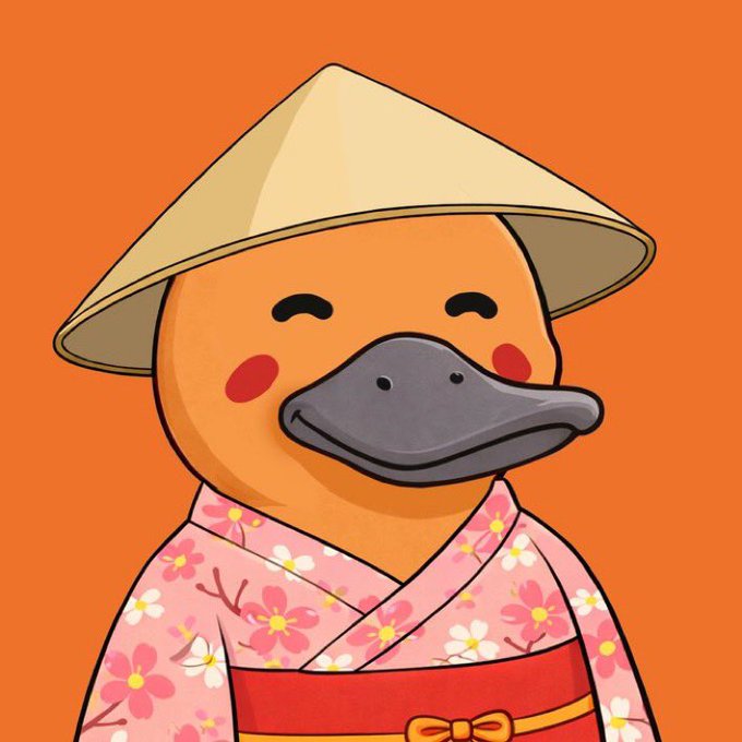 A cute cartoon platypus wearing a traditional conical Asian hat and a pink floral kimono with a red sash smiles against an orange background. The image appears to be a character mascot for the Platapeeps crypto project, accompanying a giveaway promotion.
