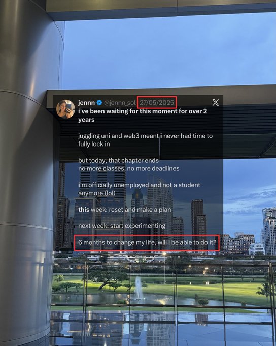 The image shows a cityscape view from an office window, with a person's name displayed at the top of the photo. Below this, there are two lines of text that read "almost a year has passed since i finished uni i had no idea i would achieve the things i have since then - traveled for the first time, to 5 countries - attended my first solana breakpoint and 3 crypto events total". The focus on these details suggests that the image is related to an online post or message about someone's experiences in a foreign country.