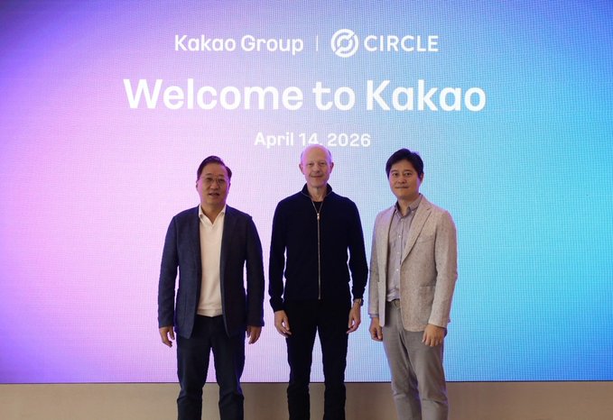 Three men in business attire stand in front of a screen reading "Kakao Group | Circle - Welcome to Kakao - April 14, 2026".